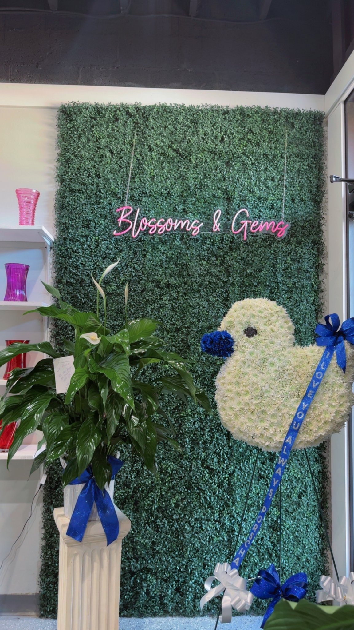 Custom flower duck design — white flower duck with blue beak and blue ribbon, in the Blossoms and Gems shop
